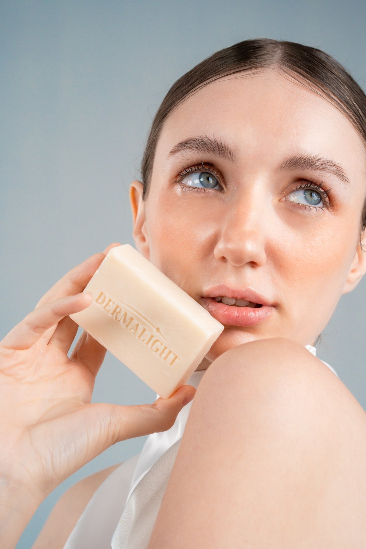 Aurelia revitalizing face cream on a sunlit windowsill